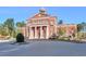 Elegant brick building featuring classic architectural details, manicured landscaping, and a stately entrance at 12084 Cotton Aly, Alpharetta, GA 30009
