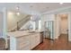 Kitchen with large island, stainless steel appliances, and open access to the stairway at 12084 Cotton Aly, Alpharetta, GA 30009