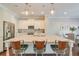 Modern kitchen with a large island, stainless steel appliances, and sleek pendant lights at 12084 Cotton Aly, Alpharetta, GA 30009
