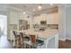 Spacious kitchen featuring a central island with pendant lighting and bar stool seating at 12084 Cotton Aly, Alpharetta, GA 30009