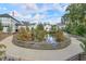 Scenic community pond with surrounding walking path offers a peaceful outdoor space for residents at 12084 Cotton Aly, Alpharetta, GA 30009
