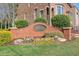 Community entrance with brick signage and manicured landscaping creating a welcoming atmosphere at 12084 Cotton Aly, Alpharetta, GA 30009