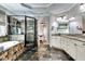 Bathroom featuring a glass shower, tub, mosaic tile, and granite countertop at 1897 8Th St, Atlanta, GA 30341