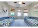 Bedroom featuring twin beds, carpeted floors, three windows, and recessed lights at 1897 8Th St, Atlanta, GA 30341