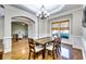 Formal dining room with hardwood floors, wainscoting, and chandelier at 1897 8Th St, Atlanta, GA 30341