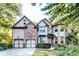 Charming home with a well-maintained lawn, stone accents, and a two-car garage at 1897 8Th St, Atlanta, GA 30341