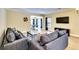 Living room with hardwood floors, two sofas, and a view of a game room at 1897 8Th St, Atlanta, GA 30341