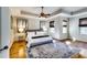 Spacious main bedroom with tray ceiling, hardwood floors, and neutral paint at 1897 8Th St, Atlanta, GA 30341