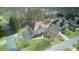 Aerial view of a two-story brick home in a landscaped neighborhood on a corner lot at 198 Grandmar Chase, Canton, GA 30115