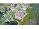 A home boasts of a backyard deck and mature landscaping, all captured from an aerial perspective at 198 Grandmar Chase, Canton, GA 30115