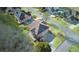 Aerial shot of a brick home featuring a large driveway, manicured lawn, and a private backyard deck at 198 Grandmar Chase, Canton, GA 30115