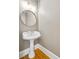 Bathroom with a pedestal sink, round mirror and recessed lighting at 198 Grandmar Chase, Canton, GA 30115