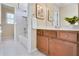 Bathroom with wood vanity and tiled shower at 198 Grandmar Chase, Canton, GA 30115