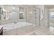 Bathroom with soaking tub, glass shower, vanity with sink, and tile flooring at 198 Grandmar Chase, Canton, GA 30115