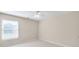 Bright bedroom with neutral walls, white trim, a ceiling fan, and a window with natural light at 198 Grandmar Chase, Canton, GA 30115