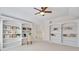 Bedroom with built-in bookshelves, ceiling fan and large windows at 198 Grandmar Chase, Canton, GA 30115