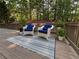 Relaxing outdoor deck area with seating and stylish rug at 198 Grandmar Chase, Canton, GA 30115