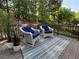 Charming outdoor deck featuring comfortable seating and views of the wooded landscape at 198 Grandmar Chase, Canton, GA 30115