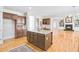 Kitchen view showcasing central island, wooden cabinets and stainless appliances at 198 Grandmar Chase, Canton, GA 30115