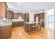 Gourmet kitchen boasts stainless appliances, center island, and wood floors at 198 Grandmar Chase, Canton, GA 30115