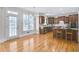 Bright kitchen features stainless appliances, granite counters, and wood floors at 198 Grandmar Chase, Canton, GA 30115