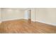 Open living area with hardwood flooring, bright neutral paint and white trim and plentiful lighting at 198 Grandmar Chase, Canton, GA 30115