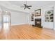 Spacious living room with hardwood floors, a fireplace, built-in shelving, and ample natural light at 198 Grandmar Chase, Canton, GA 30115