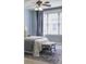 Comfortable bedroom with natural light, ceiling fan, and a neutral color palette at 273 12Th Ne St # 421, Atlanta, GA 30309