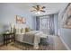 Bright bedroom with a large window, neutral décor, and comfortable seating at 273 12Th Ne St # 421, Atlanta, GA 30309