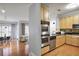 Open-concept kitchen featuring stainless steel appliances and an adjacent living space at 273 12Th Ne St # 421, Atlanta, GA 30309