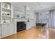 Bright living room featuring a fireplace with built-in shelves and hardwood floors at 273 12Th Ne St # 421, Atlanta, GA 30309