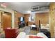 Living room with exposed brick wall, carpeted floor, and bright white couches at 273 12Th Ne St # 421, Atlanta, GA 30309