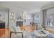 Bright living room features a fireplace, built-in shelves, hardwood floors and neutral decor at 273 12Th Ne St # 421, Atlanta, GA 30309