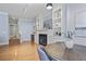 Bright living room featuring a fireplace with built-in shelving and hardwood floors at 273 12Th Ne St # 421, Atlanta, GA 30309