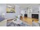 Cozy living room features an open floor plan, fireplace and hardwood floors at 273 12Th Ne St # 421, Atlanta, GA 30309
