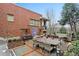 An outdoor patio featuring a beautiful fountain, a large dining table, and comfortable seating at 273 12Th Ne St # 421, Atlanta, GA 30309