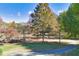 Scenic view of a park with walking path, mature trees, green grass, and a lamppost at 273 12Th Ne St # 421, Atlanta, GA 30309