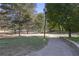 A walking path leading through a park with grassy lawns and trees at 273 12Th Ne St # 421, Atlanta, GA 30309