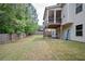 A view of the home's backyard, back deck, and wooden fence line at 2927 Dolostone Way, Dacula, GA 30019