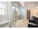 Spa-like bathroom featuring a large glass shower, double vanity, and a convenient built-in bench at 2927 Dolostone Way, Dacula, GA 30019