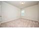 Neutral bedroom with carpet, base molding, a window with blinds, and electrical outlets at 2927 Dolostone Way, Dacula, GA 30019
