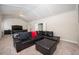 Expansive bonus room featuring a comfortable sectional, coffered ceiling, and luxurious bedroom furniture at 2927 Dolostone Way, Dacula, GA 30019