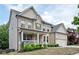 Lovely home with a covered porch, brick accents, a well-maintained lawn, and a convenient two-car garage at 2927 Dolostone Way, Dacula, GA 30019
