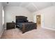 Well-appointed main bedroom with tray ceiling, modern furniture and ensuite bathroom at 2927 Dolostone Way, Dacula, GA 30019