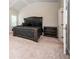 Elegantly furnished main bedroom with a vaulted ceiling, a luxurious bed, and stylish nightstands at 2927 Dolostone Way, Dacula, GA 30019