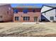 Backyard of brick house with a patio and lawn at 4892 Kentwood Dr, Marietta, GA 30068