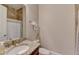 Well-lit bathroom featuring tile floors, a granite countertop vanity, and a shower with tile surround at 4892 Kentwood Dr, Marietta, GA 30068