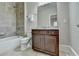 Bathroom with a combined tub and shower, a granite vanity, and modern fixtures at 4892 Kentwood Dr, Marietta, GA 30068