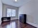 Comfortable bedroom features hardwood floors, a modern desk, and a chest of drawers at 4892 Kentwood Dr, Marietta, GA 30068