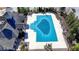 Aerial view of community pool with cover and building next to it at 4892 Kentwood Dr, Marietta, GA 30068